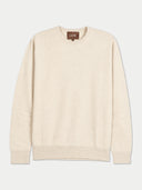 A cream-colored long-sleeve crewneck sweater by GORI, displayed flat against a light gray background.