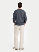 back view of a Man wearing a gray sweater and beige pants on a white background #color_plum-kitten