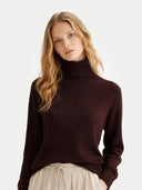 Woman wearing a brown turtleneck sweater on a white background #color_coffee-bean