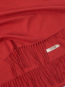 Red scarf with fringes and a visible brand label on a plain background #color_red-clay