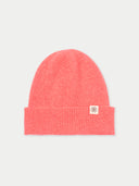 Pink beanie with a brand logo on a light gray background  #color_coral