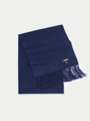 Navy blue scarf with fringes on a light gray background. #color_navy-blue
