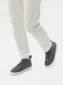 side view of a gray high top cashmere sneakers and white pants  #color_stone-gray