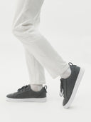 side view of a beige sneakers with white pants #color_stone-gray