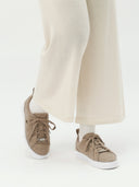 front view of a beige sneakers with white pants #color_taupe