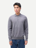 Man wearing a gray sweater and blue jeans on a white background #color_dim-gray