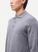 Person wearing a gray long-sleeve polo shirt on a white background #color_dim-gray