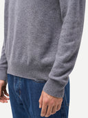 Gray sweater worn by a person on a white background #color_dim-gray