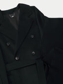 close up of a black double breasted coat and a scarf with fringes. #color_black
