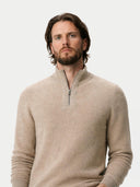 Man wearing a beige sweater with a quarter zipper on a white background #color_warm-grey