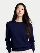 Woman wearing a navy blue sweater on a white background color_mood-indigo