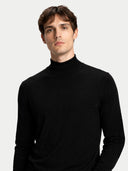 Man wearing a black turtleneck sweater on a white background #color_blue-graphite