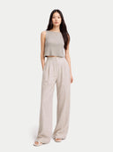 front view of a woman wearing a sleeveless top and wide-leg pants on a white background  #color_dawn-blue