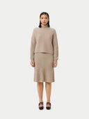 front view of a beige cropped turtle neck sweater and skirt #color_warm-grey