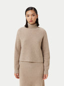 a beige turtle neck sweater #color_warm-grey