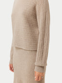 close up of a a beige rib sweater and skirt #color_warm-grey