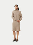 front view of a beige cropped turtle neck sweater and skirt #color_warm-grey