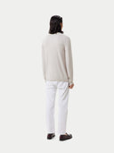 back view of a white lightweight sweater and pants #color_silver-birch
