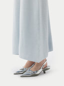 close up of a light blue long cashmere dress with heels #color_ice-flow
