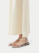 close up of a beige knee-length dress #color_marshmallow