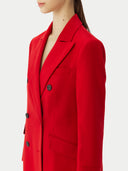 close up of a red cashmere peak lapel long coat with double-breasted design and a V-neck collar.  #color_red