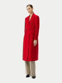 woman wearing a red cashmere peak lapel long coat with double-breasted design and a V-neck collar.  #color_red
