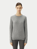 Woman wearing a gray sweater on a white background #color_vapor-blue