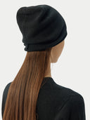 close up back view of a black beanie with a small label and sweater #color_black