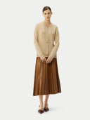 front view of a woman standing pose with a beige cardigan and brown skirt on a white background #color_beige