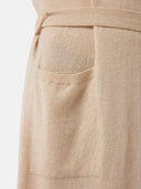 Close-up of a beige robe's pocket with a belt on a light background #color_beige