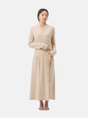 woman wearing a beige bathrobe with belt #color_beige