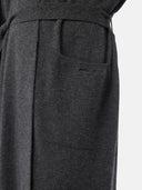 close up lower-side view of a dark gray robe with belt and side pocket