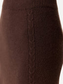 Close-up of a brown knitted sweater with cable knit pattern. #color_deep-mahogany