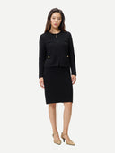 Woman wearing a black suit on a white background #color_black