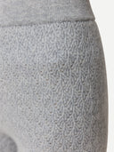 Close-up of gray textured pants with a patterned design. #color_high-rise