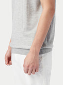 close up bottom side of a gray polo shirt #color_vapor-blue