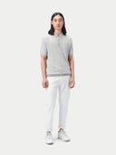 front view of a gray polo shirt and white pants #color_vapor-blue