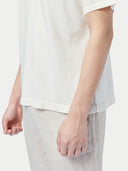 close up of a white top and pants #color_whisper-white