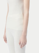 close up bottom side of a white tank top and pants #color_whisper-white