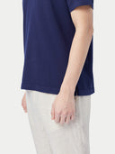 close up of a navy polo with white pants #color_navy 