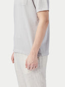 close up of a white gray polo short bottom side #color_wind-chime