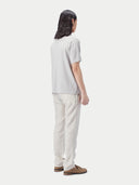 back view of a white gray polo shirt and pants #color_wind-chime