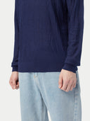 close up bottom side of a navy wrinkled textured sweater #color_navy-blazer