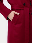 Red coat with a hand in the pocket on a white background #color_bordeaux