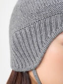 Close-up of a gray knitted hat with a plain background #color_dim-gray