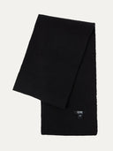 Black scarf with a brand label on a white background #color_black