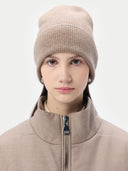 woman wearing a beige beanie with jacket #color_taupe