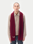 front view of a bordeaux color scarf with and beige jacket #color_bordeaux