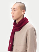 side view of a bordeaux color scarf with and beige coat #color_bordeaux