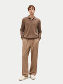 Man wearing a brown long-sleeve shirt and beige pants on a white background #color_taupe